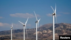 Wind turbines operate at a wind farm near Milford, Utah May 21, 2012. The Milford Wind Corridor Project, developed by the First Wind energy company, is a 306-megawatt, 165-unit wind farm. Picture taken May 21, 2012.