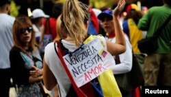 Opposition supporters attend a rally to pay tribute to victims of violence during protests against Venezuelan President Nicolas Maduro's government in Caracas, Venezuela, July 24, 2017.