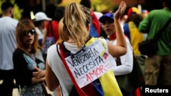 Opposition supporters attend a rally to pay tribute to victims of violence during protests against Venezuelan President Nicolas Maduro's government in Caracas, Venezuela, July 24, 2017. 
