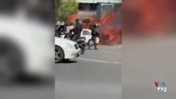 خودروی «یگان ویژه» در میدان انقلاب تهران در آتش
