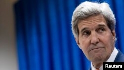 U.S. Secretary of State John Kerry pauses as he speaks during a news conference at the U.S. embassy in the International Zone in Baghdad, June 23, 2014