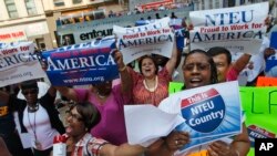 FILE - Federal employees from the New York metropolitan area chant slogans during a “Proud to Work for America” rally in support of the federal workforce, July 19, 2011, in New York. 