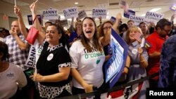 Supporters cheer as results come in for Democratic candidate Danny O’Connor in a special congressional election in Ohio’s 12th district, at the election night party in Westerville, Ohio, Aug. 7, 2018.