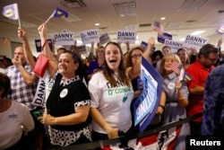 Supporters cheer as results come in for Democratic candidate Danny O’Connor in a special congressional election in Ohio’s 12th district, at the election night party in Westerville, Ohio, Aug. 7, 2018.