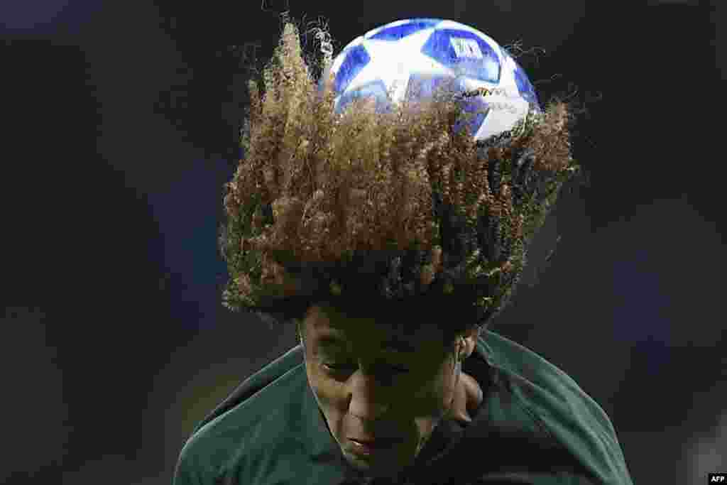 Monaco&#39;s Han-Noah Massengo plays the ball off his head during the UEFA Champions League football match between Atletico Madrid and Monaco, at the Wanda Metropolitano stadium in Madrid, Spain, November 28, 2018.