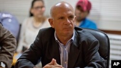 On Jan. 20, 2016, United Socialist Party of Venezuela lawmaker Hugo Carvajal attends a meeting at the National Assembly administrative offices, in Caracas, Venezuela.