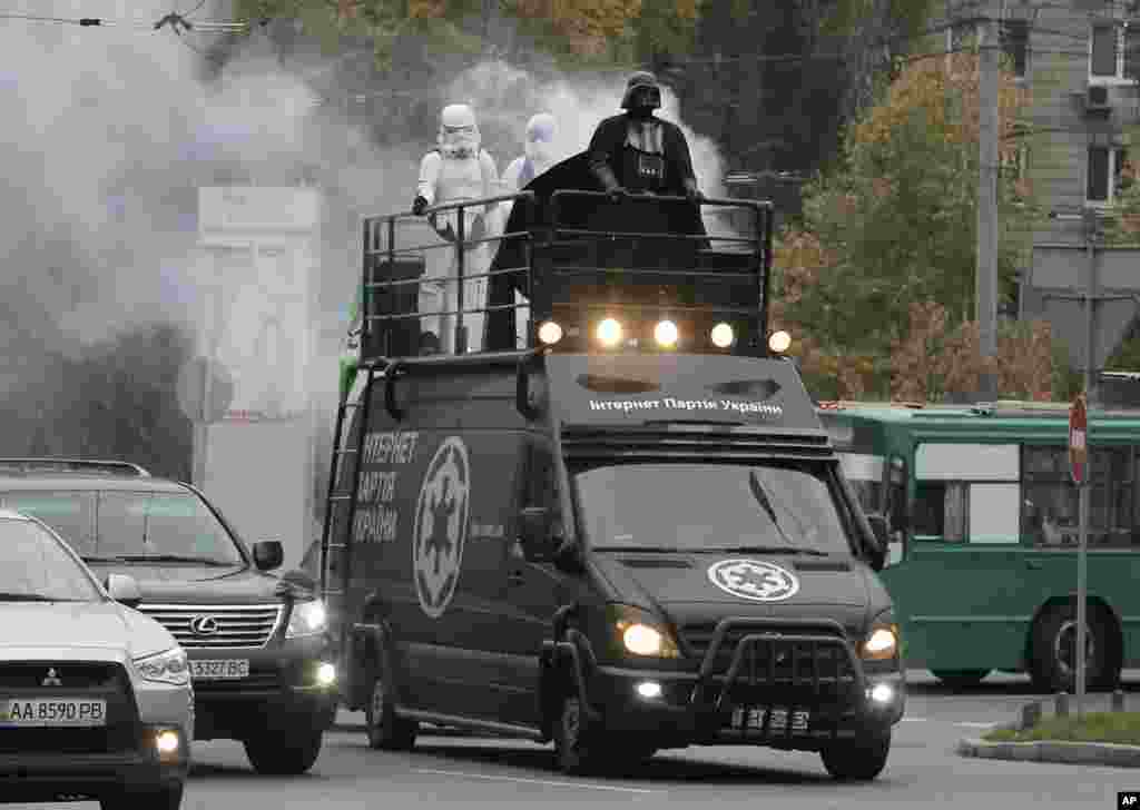 Darth Vader, leader of Ukraine&#39;s Internet Party, rides atop a car in Kyiv, Ukraine. Vader is campaigning for the Oct. 26 parliamentary elections on a platform of promoting e-government and increasing financial transparency. 
