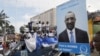 FILE - Supporters of Union des Forces Republicaines (UFR) presidential candidate Sidya Toure attend his campaign rally at the yard next to the parliament building in Conakry.