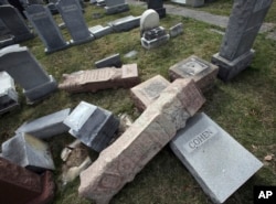 Damaged headstones rest on the ground at Mount Carmel Cemetery, Feb. 27, 2017. More than 100 headstones have been vandalized at the Jewish cemetery in Philadelphia.