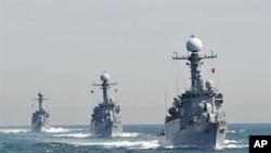 South Korean Navy Patrol Combat Corvettes stage an anti-submarine exercise at off the western coast town of Taean, 27 May 2010