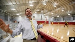 Shannon Eubanks, principal at a Brookhaven, Mississippi school, speaks during a 2014 interview a the school. Although the K-12 school has a new gym, it has also had to make tough economic cuts as the state funding formula is underfunded. (AP Photo/Rogelio V. Solis)