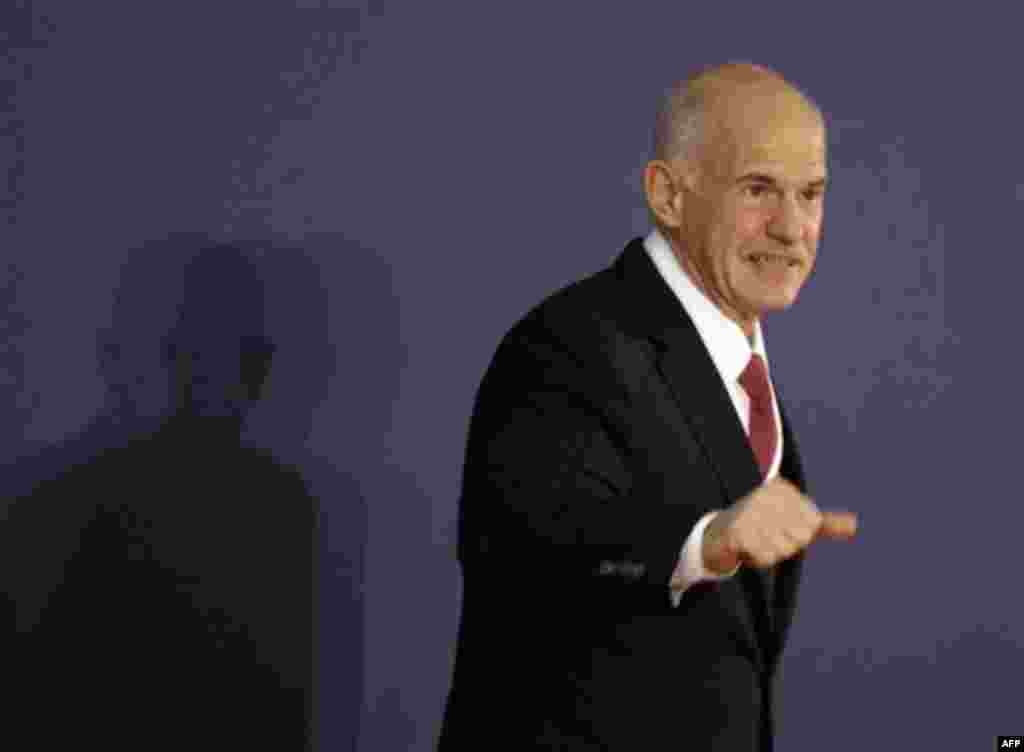 Greek Prime Minister George Papandreou arrives at the G20 summit in Cannes, Wednesday Nov.2, 2011. Papandreou arrived to the chic French Riviera resort of Cannes to explain himself to European leaders furious over his surprise referendum on a bailout dea