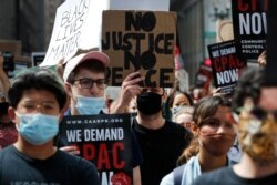 Protesters march around Chicago's City Hall on June 17, 2020.