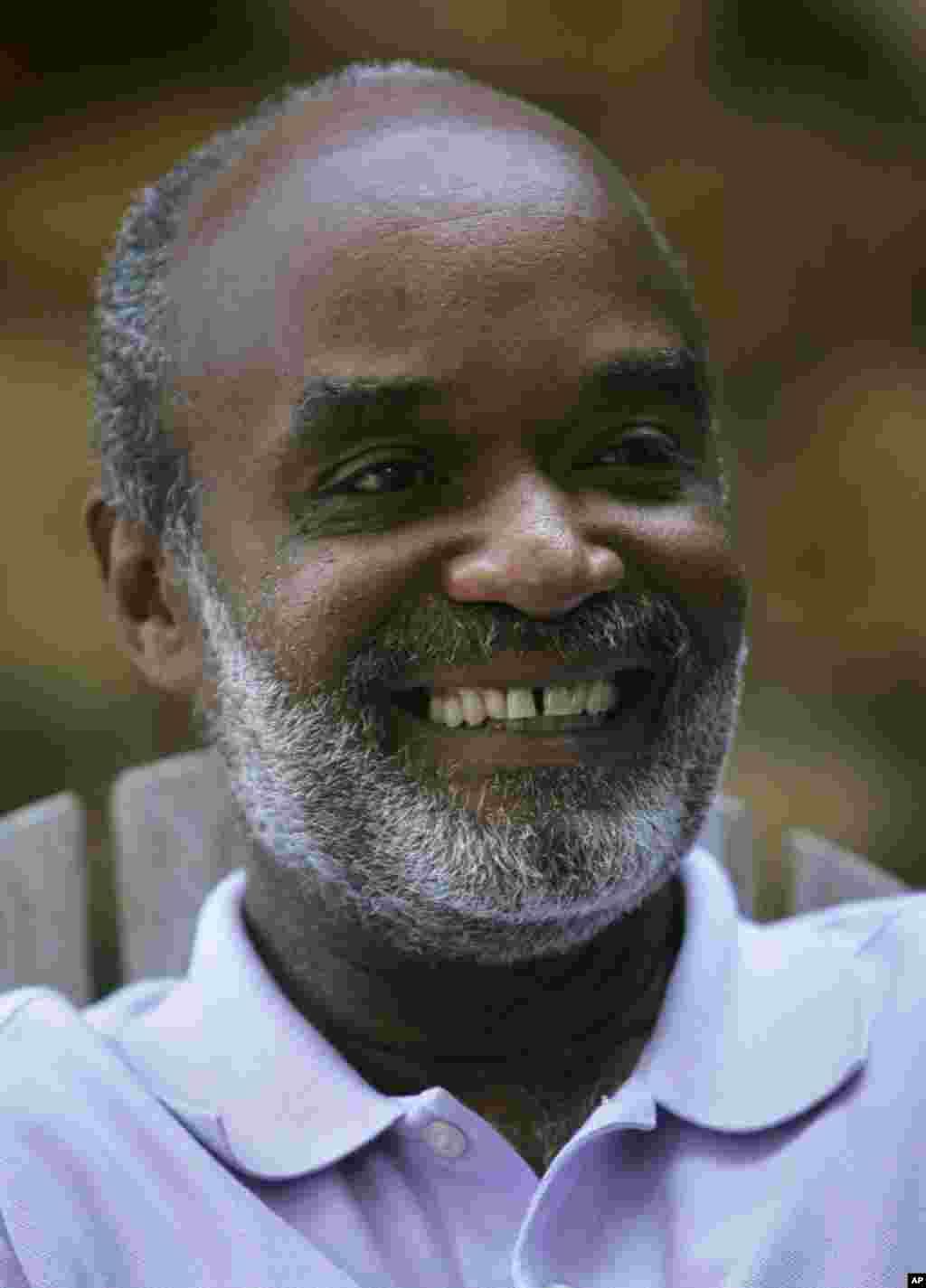 Front-running Haitian presidential candidate Rene Preval smiles while responding to a question, during an interview at a private home in Port au Prince, Tuesday, Jan. 17, 2006. Preval asserted Tuesday that, if elected, he thinks he can begin to pull Haiti