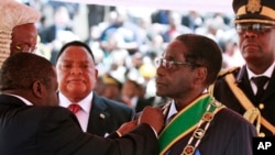 Zimbabwean President Robert Mugabe, 89, is sworn in for his seventh term, in Harare, Aug. 22, 2013. 