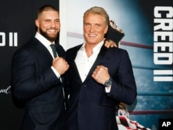 Florian Munteanu, left, and Dolph Lundgren, right, attend the world premiere of "Creed II" at the AMC Loews Lincoln Square in New York, Nov. 14, 2018.