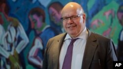 German Economy Minister, Peter Altmaier, arrives for the weekly Cabinet meeting of the German government at the chancellery in Berlin, Dec. 12, 2018.