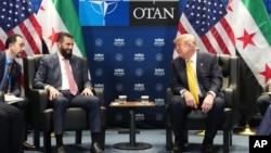 دونالد ترامپ، رئیس جمهوری آمریکا، و احمد الشرع، رئیس جمهوری سوریه (آرشیو)