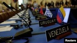 FILE - Delegates' seats are prepared for the Organization of American States' (OAS) meeting of foreign ministers to discuss the situation in Venezuela, in Washington, May 31, 2017. 