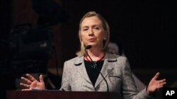 U.S. Secretary of State Hillary Rodham Clinton gestures as she talks during the Forum for the Future conference in Doha, Qatar, 13 Jan. 2011