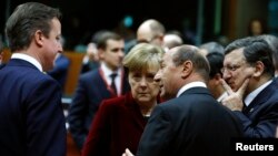 Britain's Prime Minister David Cameron (L-R), Germany's Chancellor Angela Merkel, Romania's President Traian Basescu and European Commission President Jose Manuel Barroso attend a European leaders emergency summit on Ukraine, March 6, 2013.