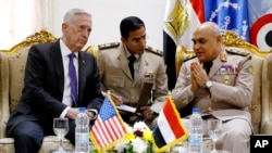 FILE - Egyptian Minister of Defense Sedki Sobhi (right) meets with U.S. Defense Secretary James Mattis (left) upon his arrival at Cairo International Airport in Cairo, April 20, 2017.