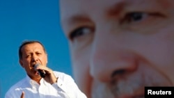 Turkey's Prime Minister and presidential candidate Tayyip Erdogan addresses his supporters during an election rally in Istanbul, August 3, 2014.