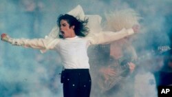 FILE - Michael Jackson performs during the halftime show at the Super Bowl XXVII in Pasadena, Calif., Jan. 31, 1993.