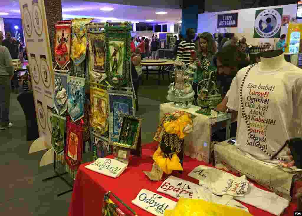 Booths in the Africa House or &quot;Casa de Africa&quot; display African accessories, books and t-shirts