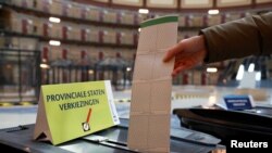 A person casts their vote during the provincial elections at a polling station at a former prison De Koepelgevangenis in Arnhem, Netherlands March 15, 2023. 