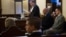 Pope Benedict's former butler Paolo Gabriele (R), accused of stealing and leaking the pontiff's personal papers, sits at the start of his trial at the Vatican September 29, 2012.