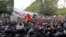 Demonstrators attend a protest to mark the anniversary of a prominent activist's death and against allegations of police abuse, in Tunis, Tunisia, Feb. 6, 2021. 