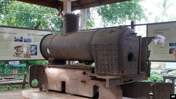 In this June 20, 2016, photo, a broken train’s engine is displayed for tourists in Lao territory near a controversial Don Sahong dam on the Mekong River, along Cambodia-Lao borders.