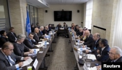 FILE - General view during a meeting between U.N. Syria envoy Staffan de Mistura and members of the Syrian interior opposition during Syria peace talks at the United Nations Office.