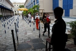 FILE - Local tourists visit the Grand Palace as it reopens after months of being closed, as the Thai government eases isolation measures amid the spread of the coronavirus disease in Bangkok, Thailand, June 7, 2020.lva