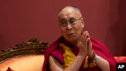 FILE - Exile Tibetan spiritual leader the Dalai Lama listens a to speaker at an event organized by his well-wishers in New Delhi, India, Monday, Jan. 4, 2016. 