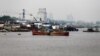 FILE - Fishing vessels are seen docked along the Congo River in the Democratic Republic of Congo's capital Kinshasa, Dec. 21, 2016. A current drought has left water levels in the Congo River at their lowest point in the past 100 years.