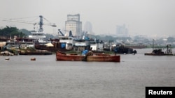 FILE - Fishing vessels are seen docked along the Congo River in the Democratic Republic of Congo's capital Kinshasa, Dec. 21, 2016. A current drought has left water levels in the Congo River at their lowest point in the past 100 years.