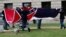 A Mississippi Highway Safety Patrol honor guard carefully folds the retired Mississippi state flag after it was raised over the Capitol grounds one final time in Jackson, Miss., July 1, 2020.