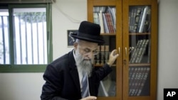 Israeli rabbi Mordechai Nagari, one of the signatories of the controversial ruling, poses for a photo in his office in the Jewish West Bank settlement of Maaleh Adumim near Jerusalem, 07 Dec 2010