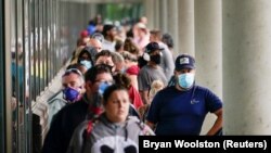 USA, Kentucky, FILE PHOTO: Hundreds of people line up outside a Kentucky Career Center 