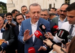 FILE - Turkish President Recep Tayyip Erdogan talks to media in Istanbul, Turkey, June 4, 2019.