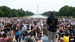 Demonstrators protest Saturday, June 6, 2020, at the Lincoln Memorial in Washington, over the death of George Floyd, a black man who was in police custody in Minneapolis. Floyd died after being restrained by Minneapolis police officers. 