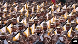 FILE - Iran's Revolutionary Guard members march during an annual military parade outside Tehran, Iran, Sept. 22, 2023. 