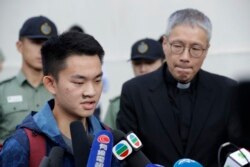 Chan Tong-kai, left, talks to the media as he is released from prison in Hong Kong, Oct. 23, 2019.