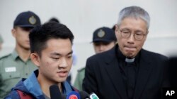 Chan Tong-kai, left, talks to the media as he is released from prison in Hong Kong, Oct. 23, 2019. 