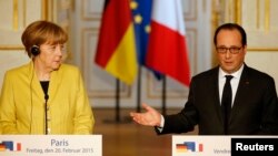 FILE - Documents cited by WikiLeaks reportedly include summaries of French officials' conversations on, among other things, the relationship between the administrations of German Chancellor Angela Merkel and French President Francois Hollande.