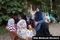 Humaira Rafaqat engages with women during a motorbike training session as part of the "Women on Wheels" program organized by the traffic police department in Lahore, Pakistan, October 1, 2024. (REUTERS/Nida Mehboob)