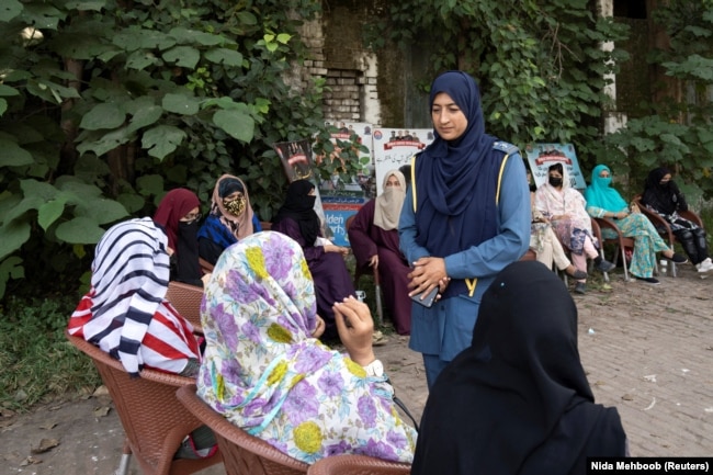 Humaira Rafaqat engages with women during a motorbike training session as part of the "Women on Wheels" program organized by the traffic police department in Lahore, Pakistan, October 1, 2024. (REUTERS/Nida Mehboob)