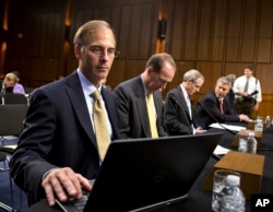 FILE - Mark Zandi, chief economist with Moody’s Analytics testifies at a Joint Economic Committee hearing on Capitol Hill in Washington.